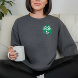 A woman wearing a dark gray sweatshirt with 'IRISH AF' design, holding a white mug.