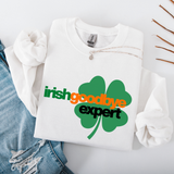 White sweatshirt with a green shamrock design and text on a light gray background