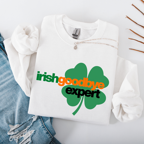 White sweatshirt with a green shamrock design and text on a light gray background
