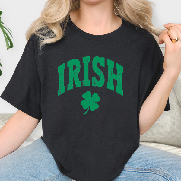 Person wearing a black t-shirt with 'IRISH' and a shamrock design.
