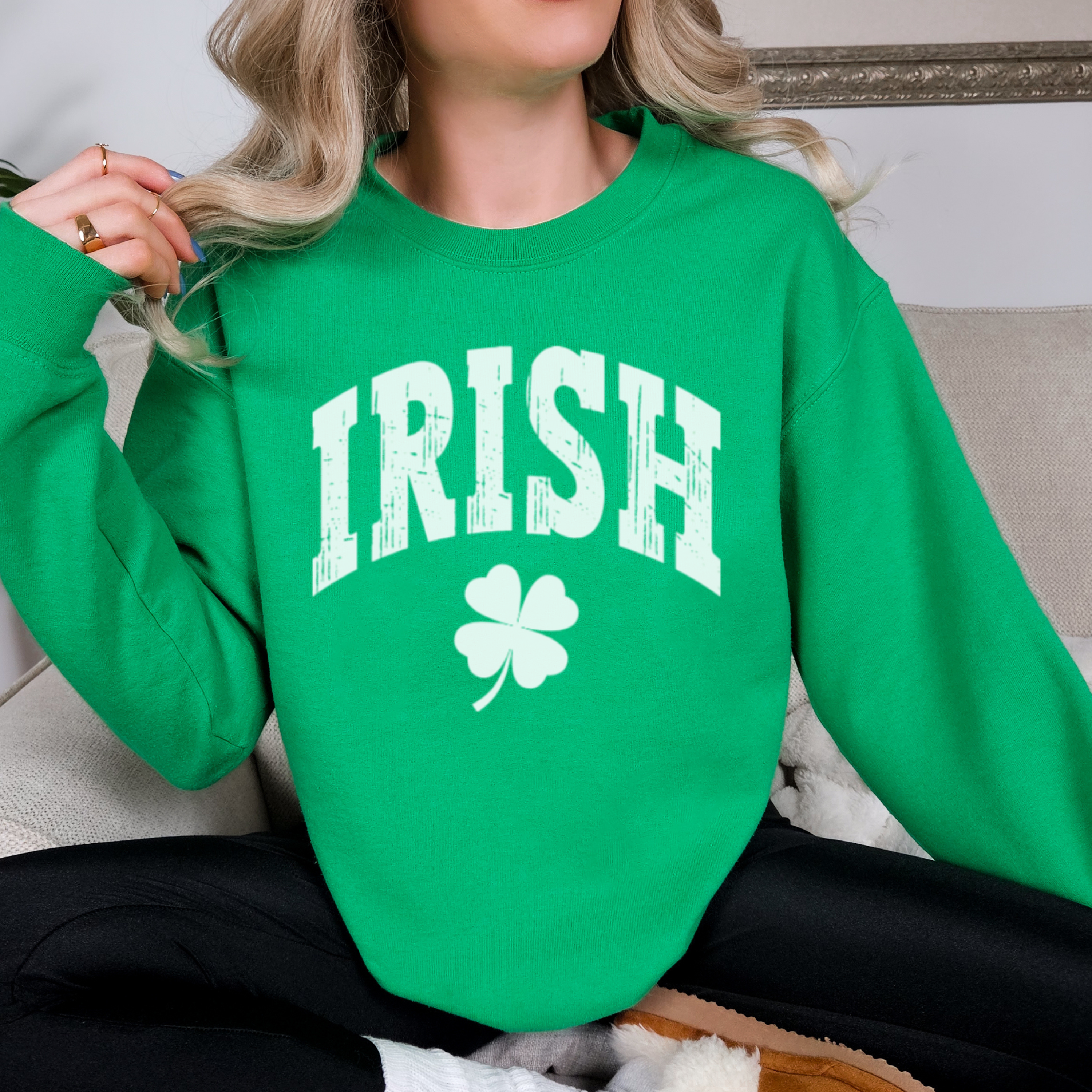 Person wearing a green sweatshirt with 'IRISH' and a clover design.