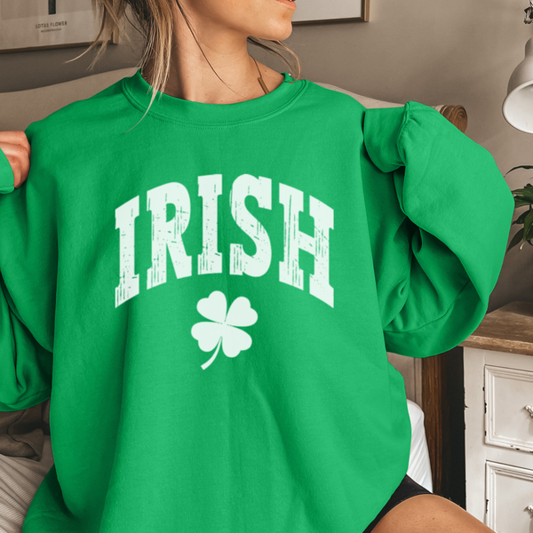 Person wearing a green sweatshirt with 'IRISH' and a shamrock design.