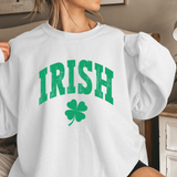 White sweatshirt with green 'IRISH' text and clover design worn by a person.