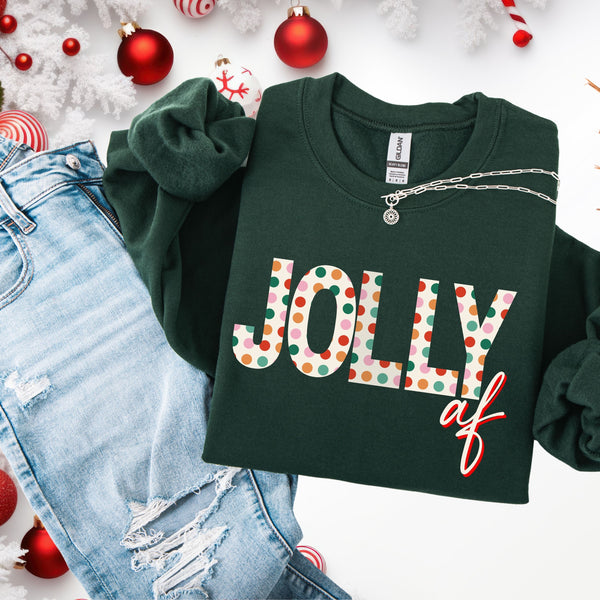 Green sweatshirt with 'Jolly af' text on a white background with Christmas decorations.
