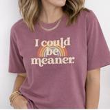 Person wearing a purple t-shirt with a rainbow and text design.