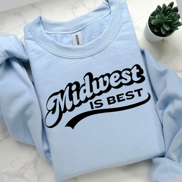 Light blue sweatshirt with 'Midwest is Best' text on a white surface.