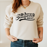 Person wearing a beige sweatshirt with 'Midwest is Best' text on a plain background