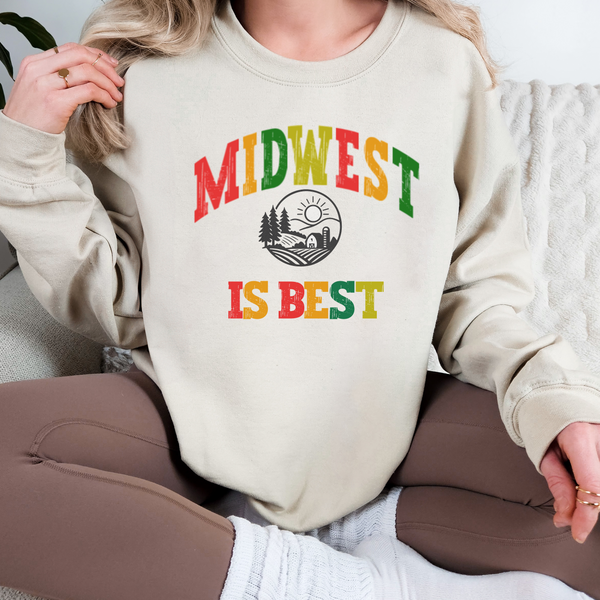 Person wearing a beige sweatshirt with 'Midwest is Best' text in colorful letters.