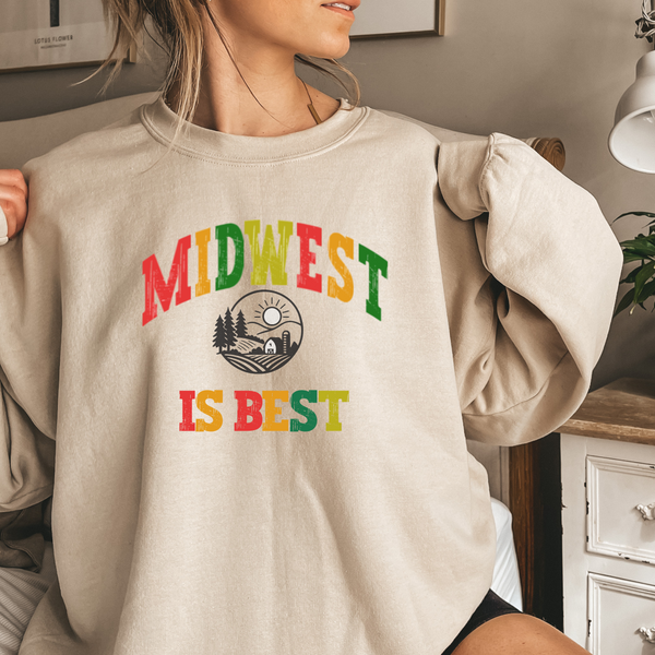 Person wearing a beige sweatshirt with 'Midwest is Best' text in colorful letters.