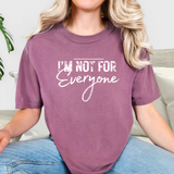 Person wearing a purple berry t-shirt with 'I'm Not For Everyone' text.