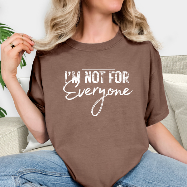 Person wearing a brown t-shirt with 'I'm Not For Everyone' text.