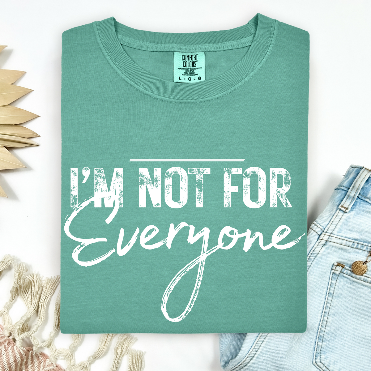 Teal t-shirt with 'I'm not for everyone' text on a white background