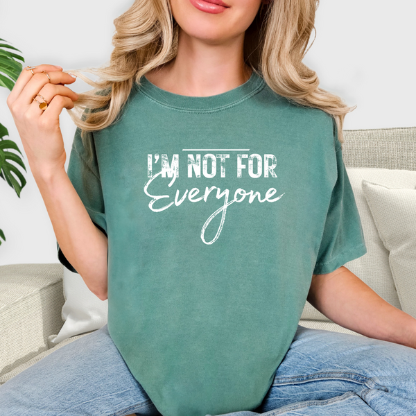 Person wearing a green t-shirt with 'I'm not for everyone' text.