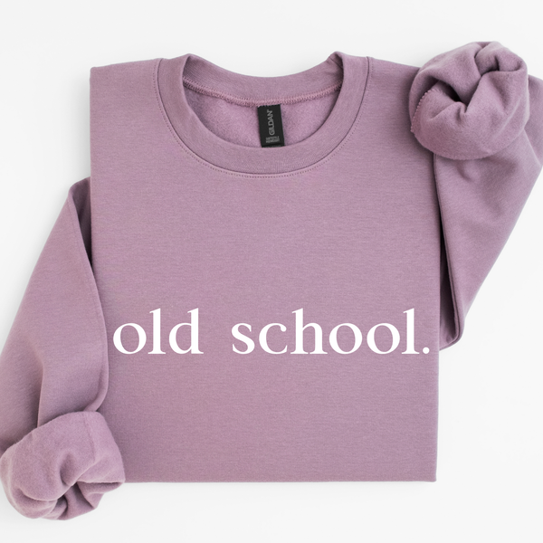 Purple paragon sweatshirt with 'old school.' text on a white background