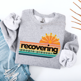Gray sweatshirt with a colorful graphic and text on a white background