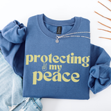 An indigo blue sweatshirt with the words 