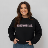 Woman wearing a black sweatshirt with 'I SAID WHAT I SAID.' text on a plain background