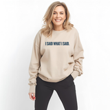 Woman wearing a beige sweatshirt with 'I SAID WHAT I SAID.' text on a white background