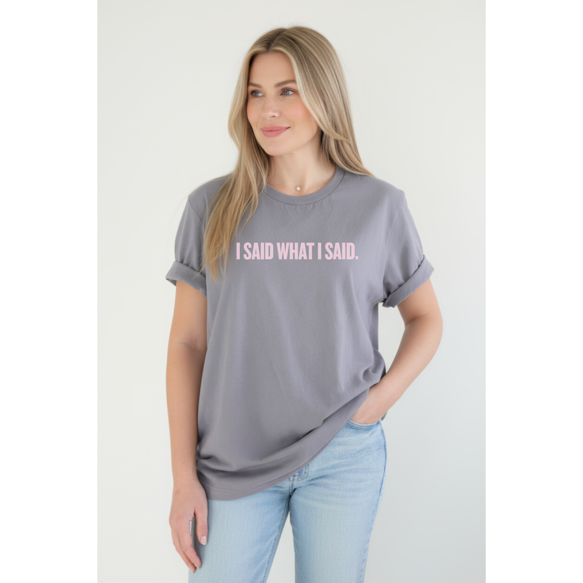 A 40-year-old woman wearing a gray t-shirt with 'I SAID WHAT I SAID' text on a white background
