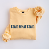 Yellow sweatshirt with 'I SAID WHAT I SAID.' text on a light gray background