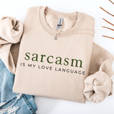 Beige sweatshirt with 'sarcasm is my love language' text on a white background