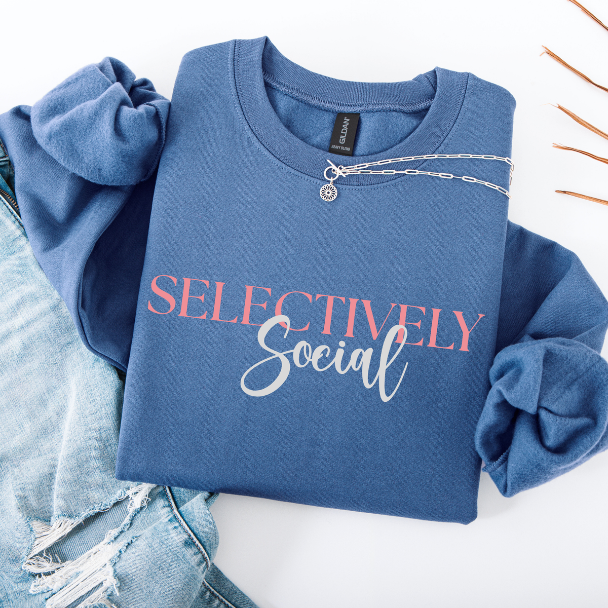 Blue sweatshirt with 'SELECTIVELY Social' text on a white background