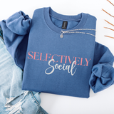 Blue sweatshirt with 'SELECTIVELY Social' text on a white background