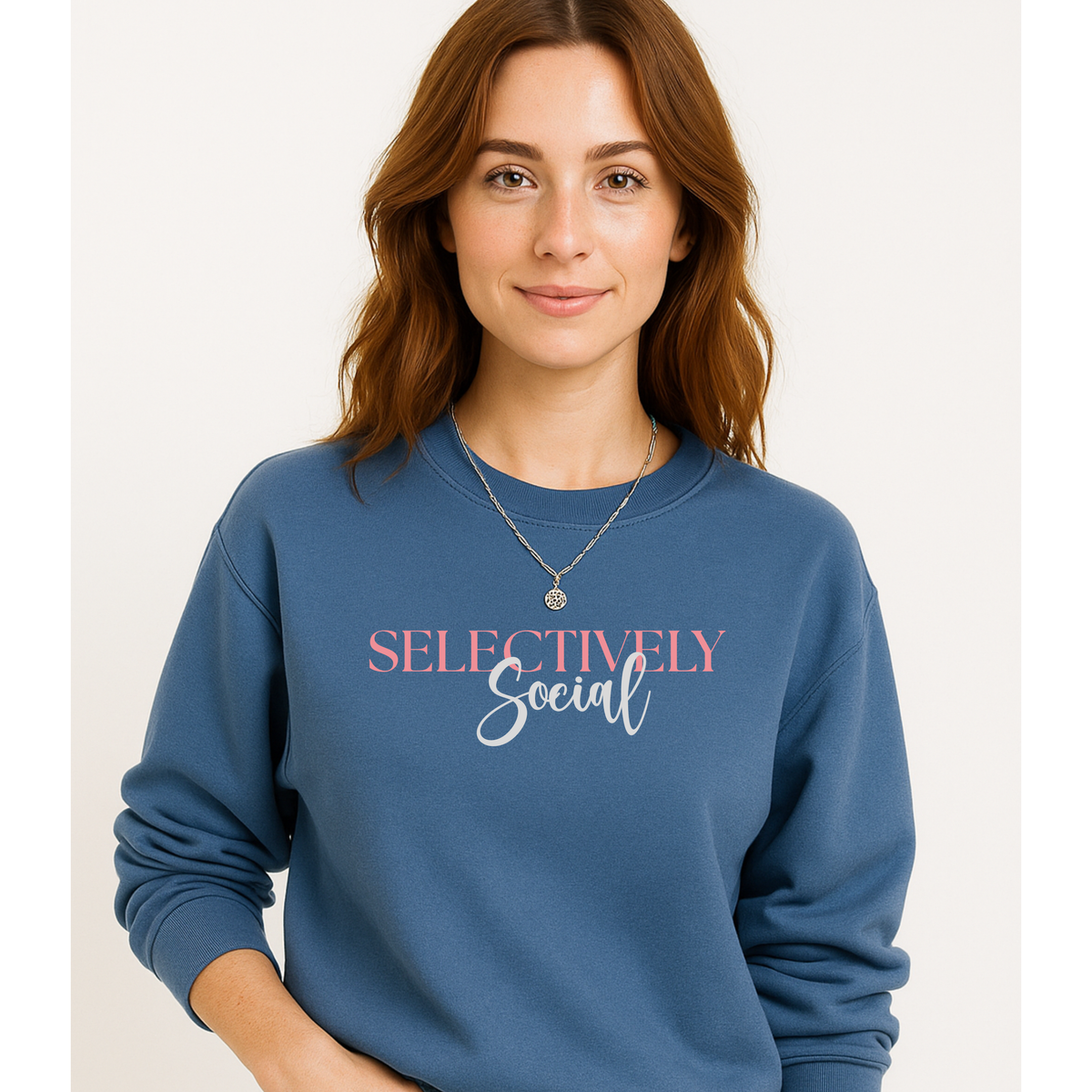 Woman wearing a blue sweatshirt with 'SELECTIVELY Social' text on a plain background
