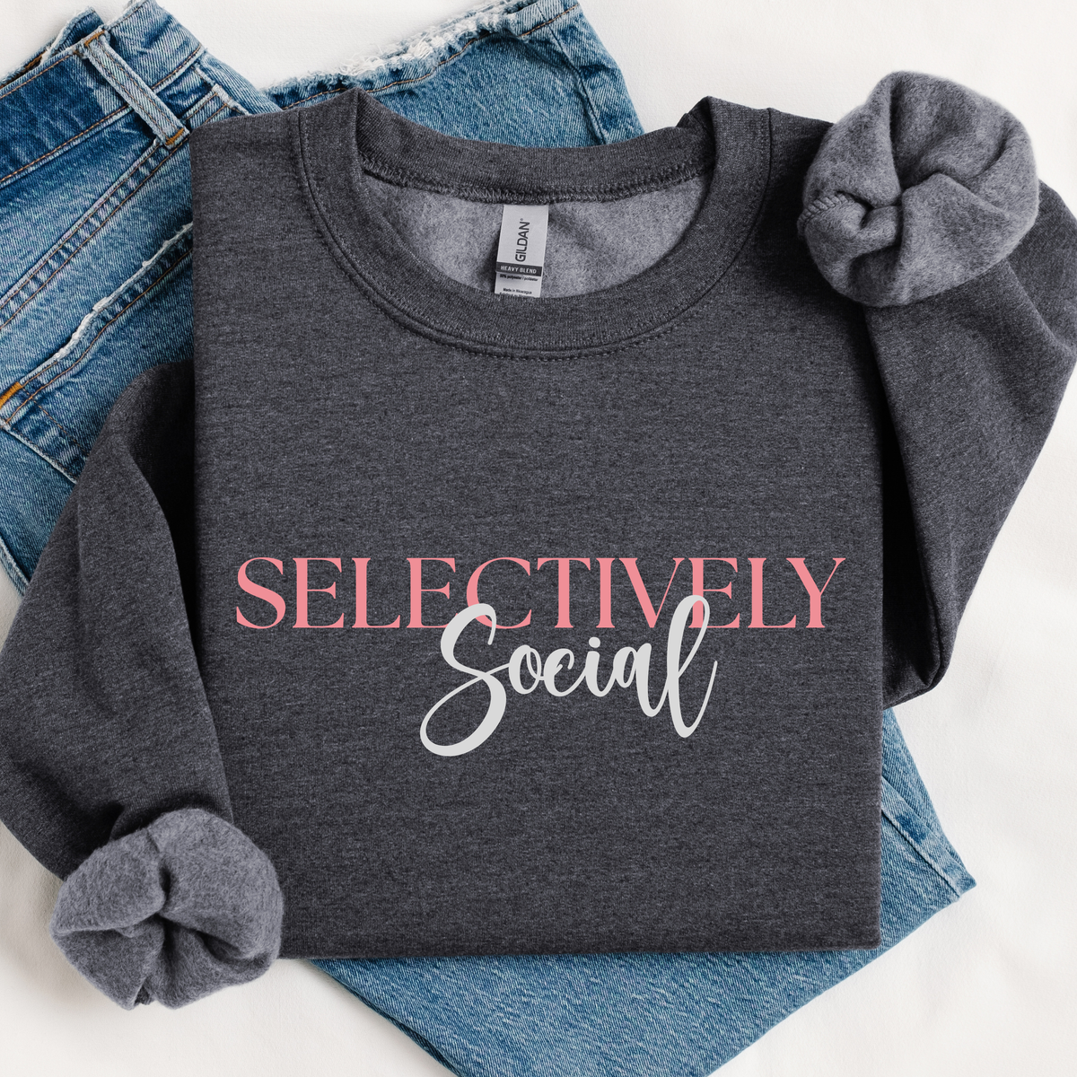 Dark gray sweatshirt with 'Selectively Social' text on a white background