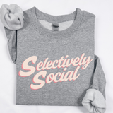 A folded gray sweatshirt with the words 