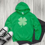 A green hoodie sweatshirt with a large lighter green shamrock in the middle.