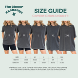 Size guide chart from The Clover Exchange showing five models wearing unisex fit comfort colors t-shirts in sizes S, M, L, XL, and 2XL, with a width and length measurement table below.