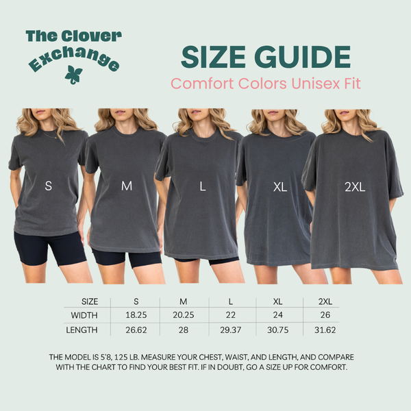 Size guide chart from The Clover Exchange showing five models wearing unisex fit comfort colors t-shirts in sizes S, M, L, XL, and 2XL, with a width and length measurement table below.