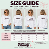 A size guide infographic for the Gildan Softstyle SFOOO crewneck sweatshirt, showing a model from the front, back, and side in small and large fits, alongside a size measurement table and The Clover Exchange branding.