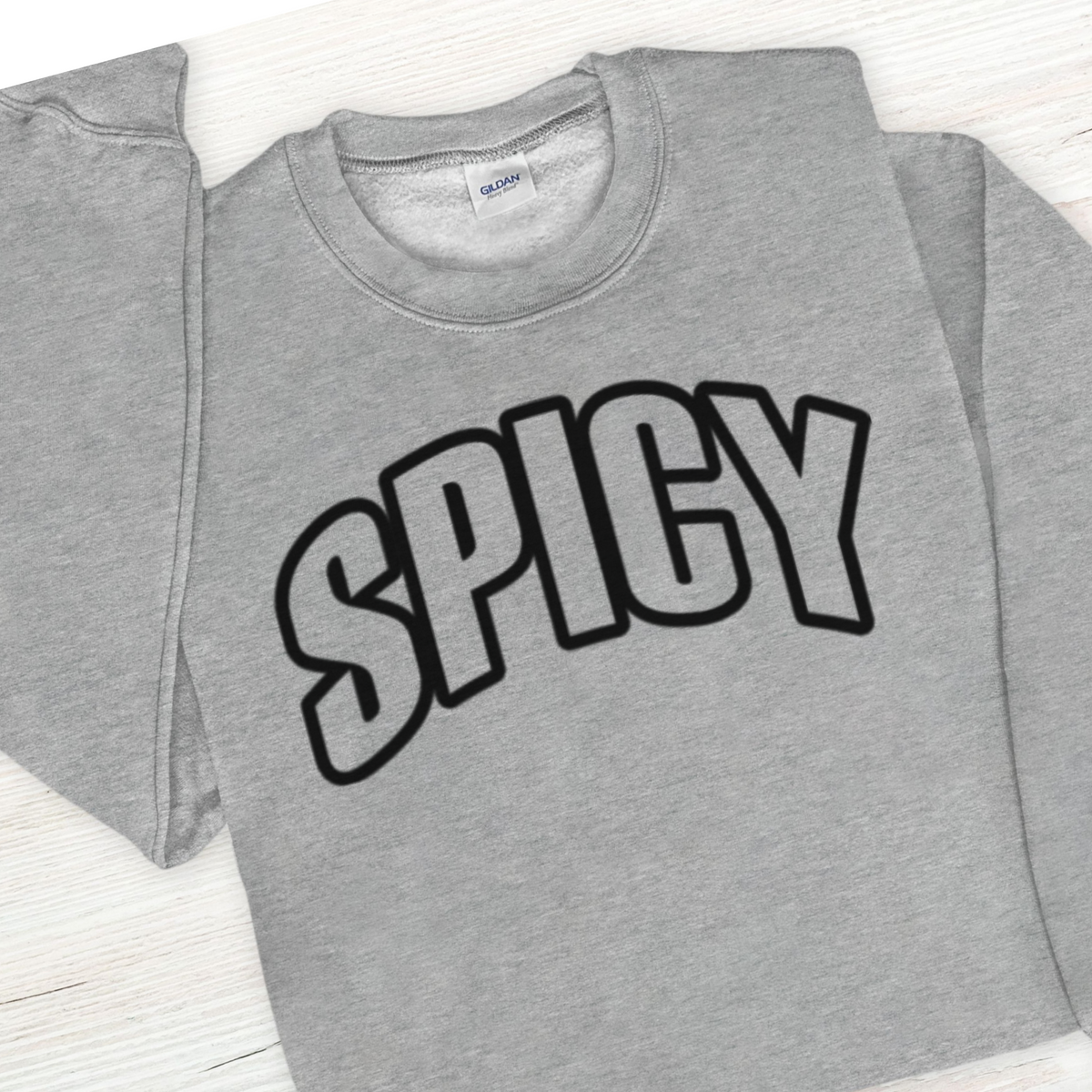 Gray t-shirt with 'SPICY' text on a white background
