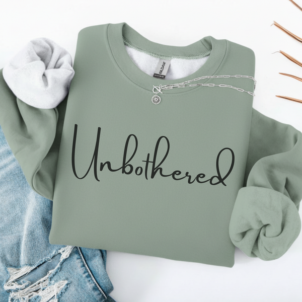 Sage Green sweatshirt with 'Unbothered' text on a white background