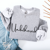 Gray sweatshirt with 'Unbothered' text on a white background