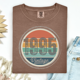 Brown t-shirt with '1995 Vintage' design on a white background