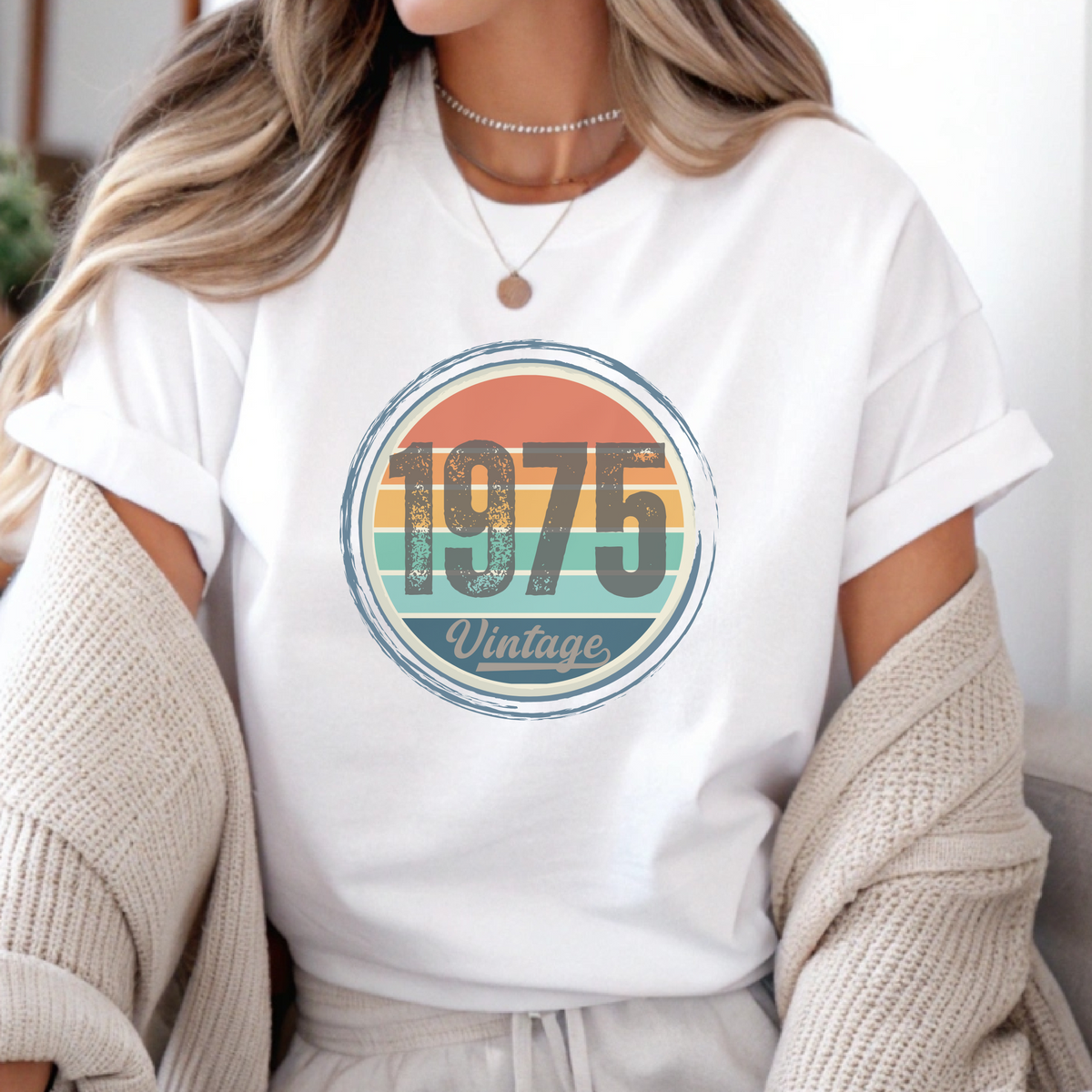 Person wearing a white t-shirt with '1975 Vintage' design.