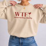 A sand colored sweatshirt that reads 