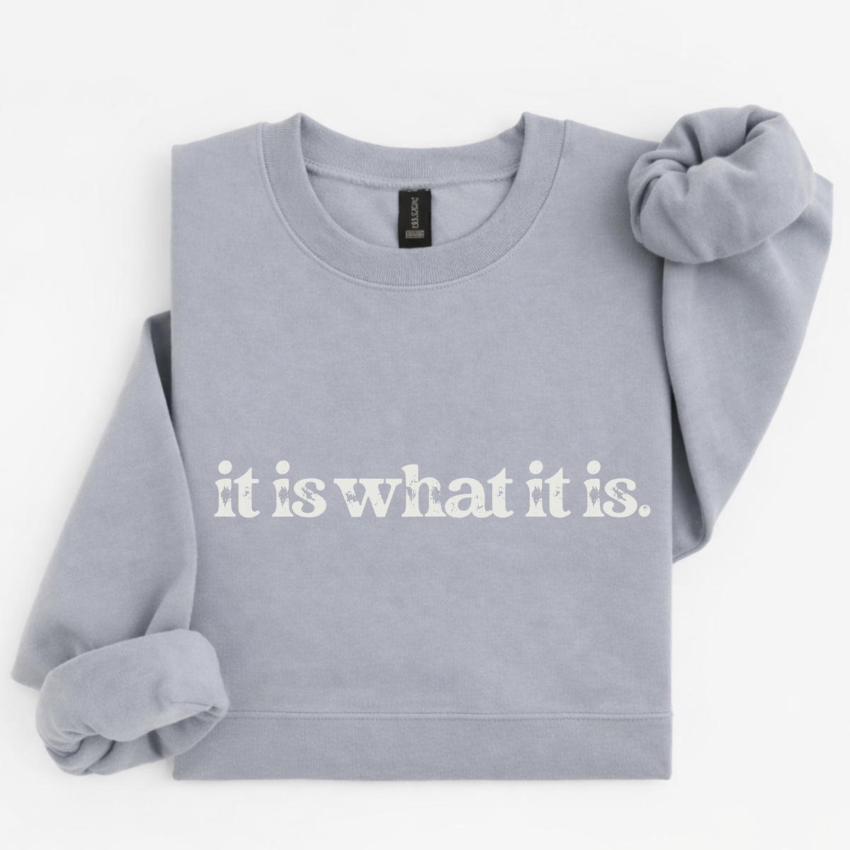 Gray sweatshirt with 'it is what it is' text on a white background