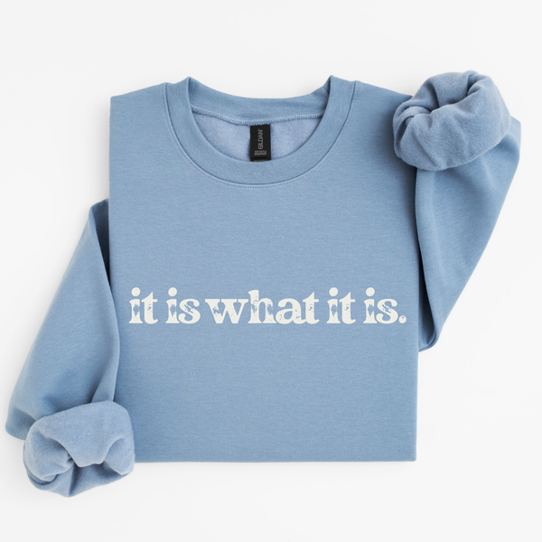 Light blue sweatshirt with 'it is what it is' text on a white background