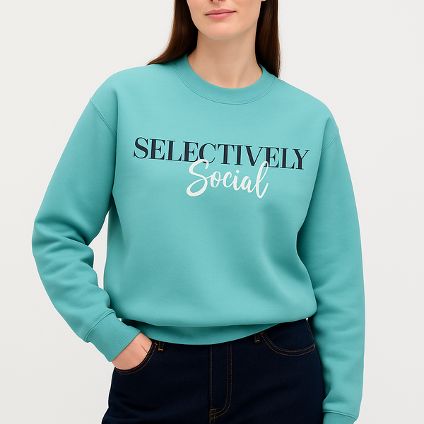 Person wearing a teal sweater with 'SELECTIVELY Social' text on a white background