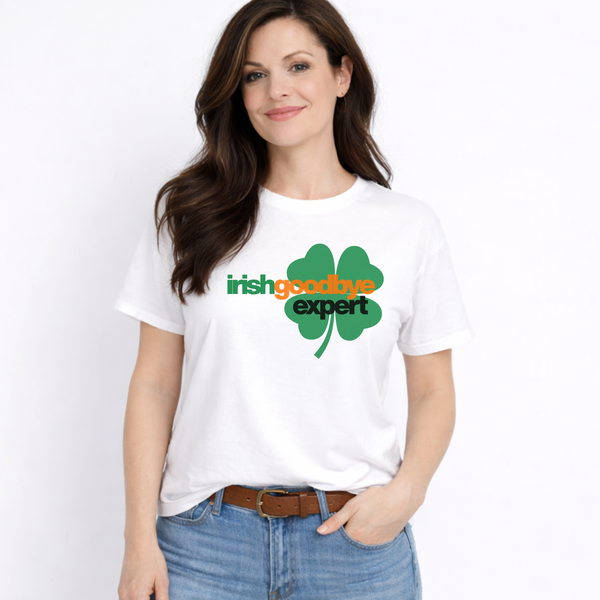 Woman wearing a white t-shirt with a shamrock design and text on a plain background