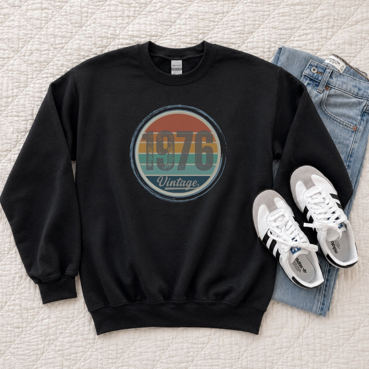Black vintage birthday sweatshirt laid flat, showing the retro sunset birth year design.